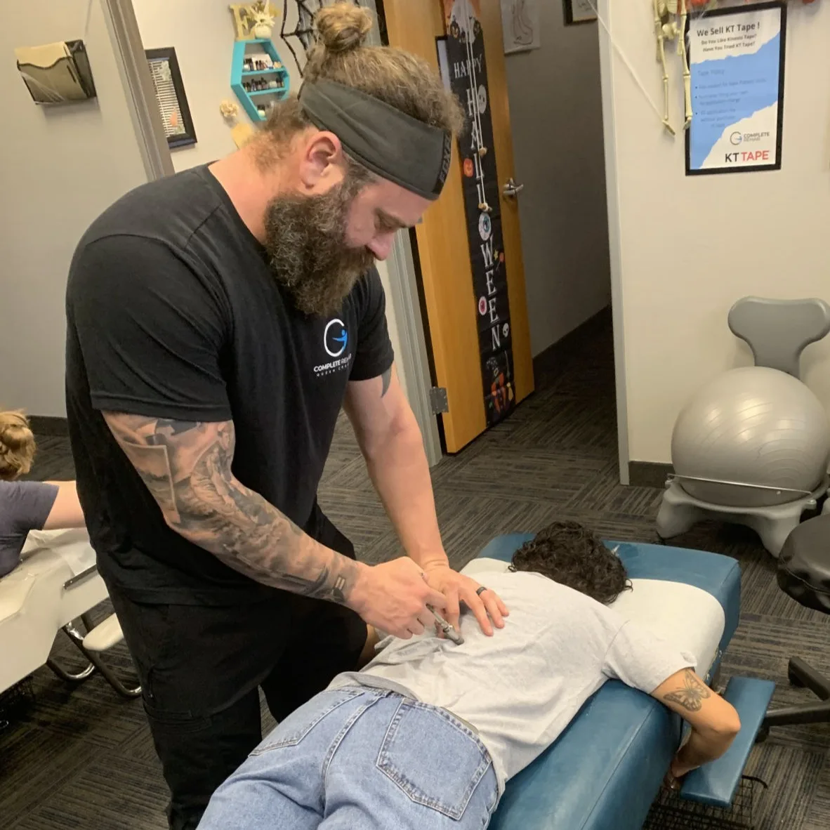 A clinician evaluates and provides hands-on care during a personal-injury visit.